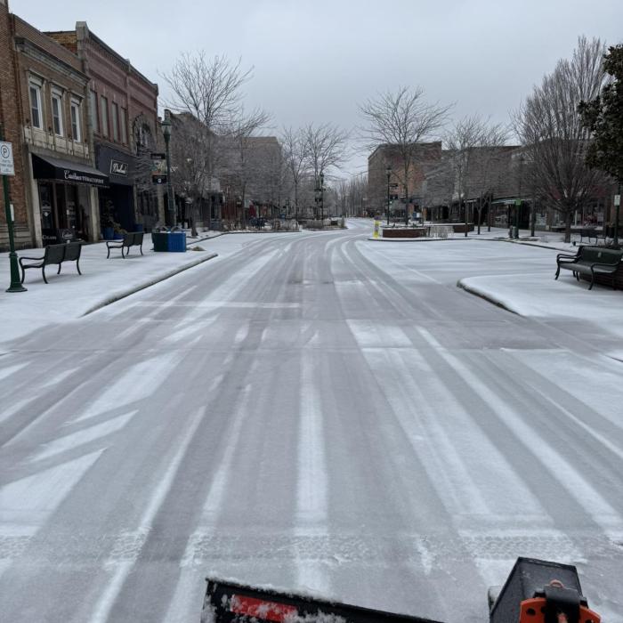 City plowing Main Street during a Winter Storm