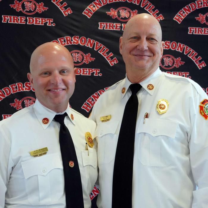 New Chief Ward standing with retiring Chief Miller