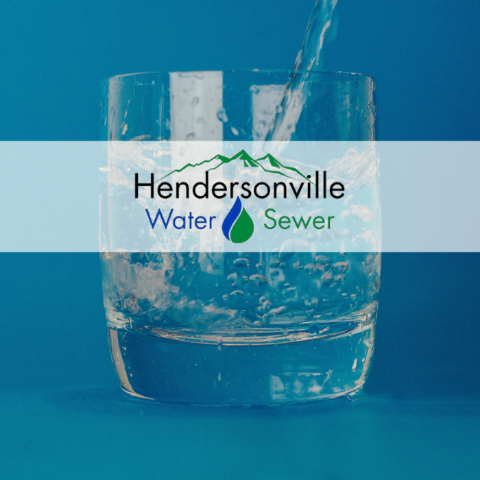 Glass of water with Hendersonville Water and Sewer Logo