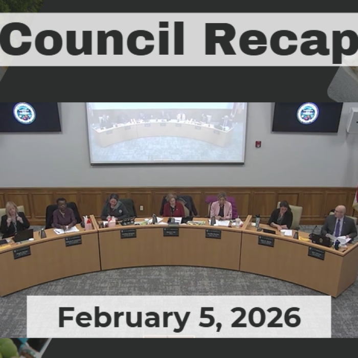 City Council members sit at dais. 