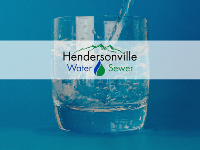 Glass of water with Hendersonville Water and Sewer Logo