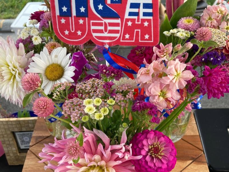 flowers with a USA sign sticking out of it 