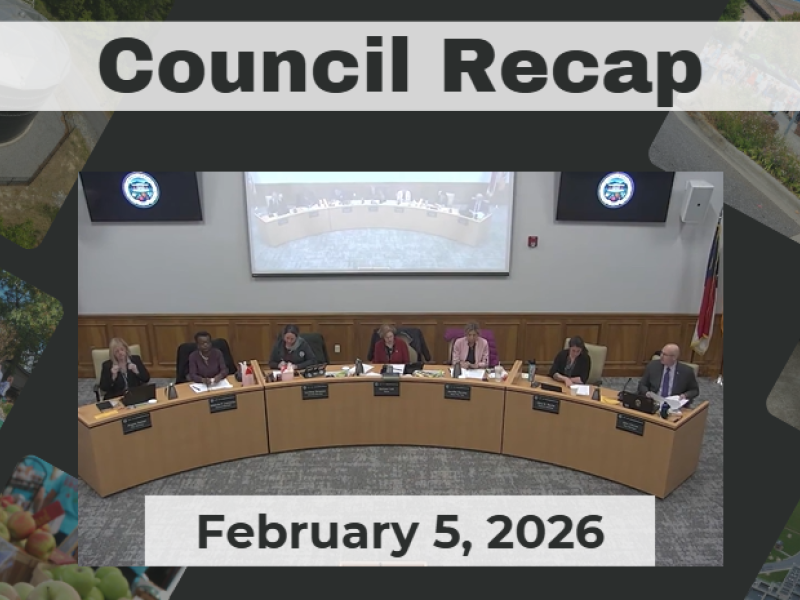 City Council members sit at dais. 