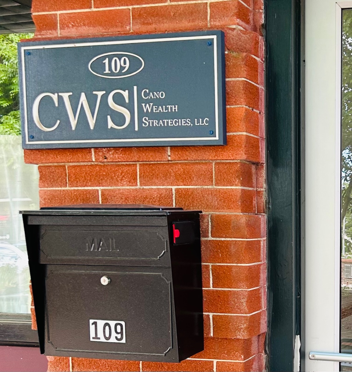 Sign by the door at 109 S. Main Street