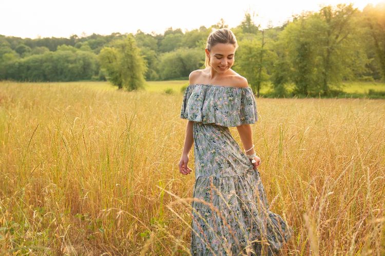 girl in field wearing a dress