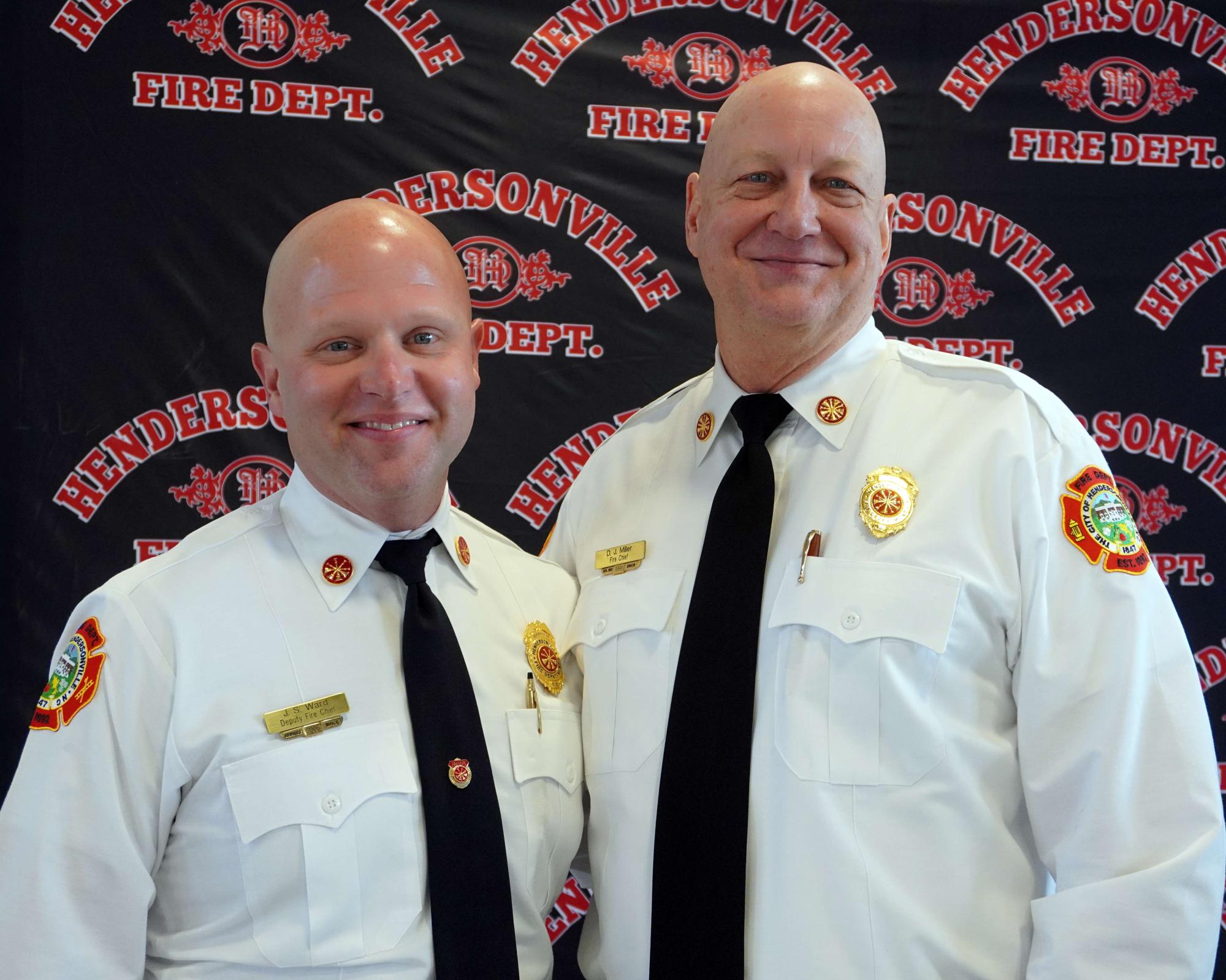 New Chief Ward standing with retiring Chief Miller