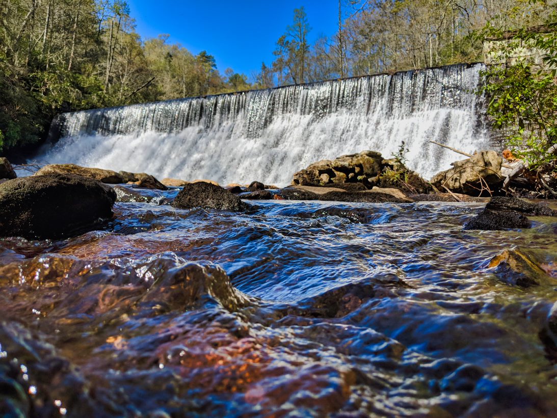 River flowing with rocks underneath