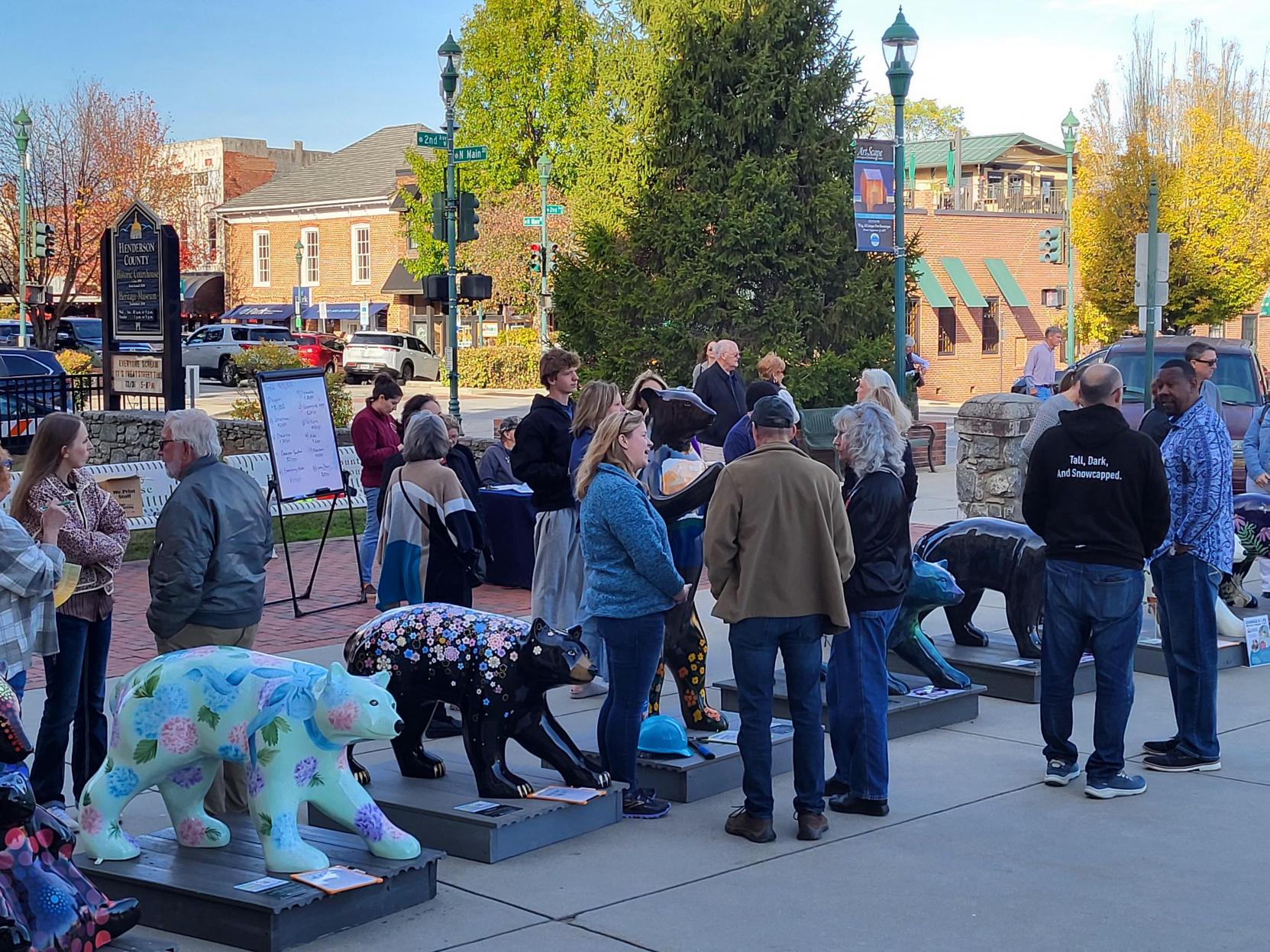 image of people standing by fiberglass painted bears