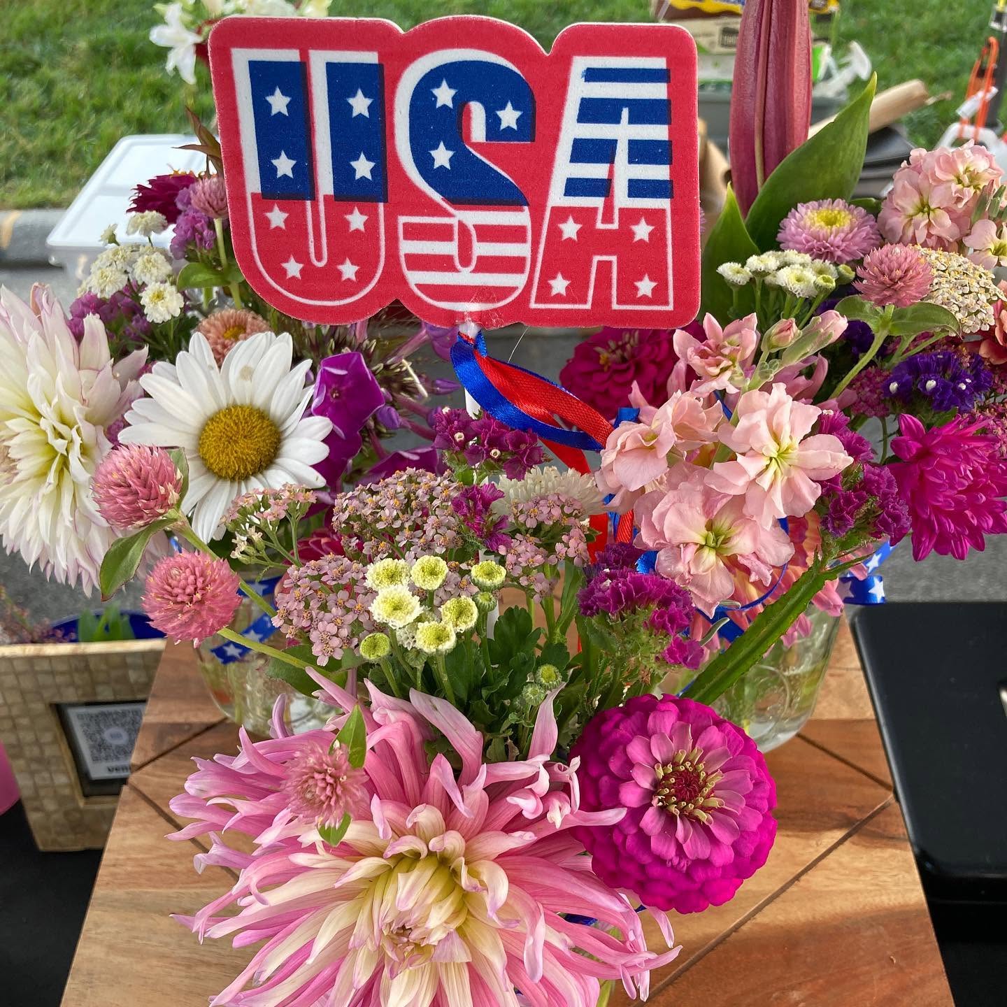flowers with a USA sign sticking out of it 