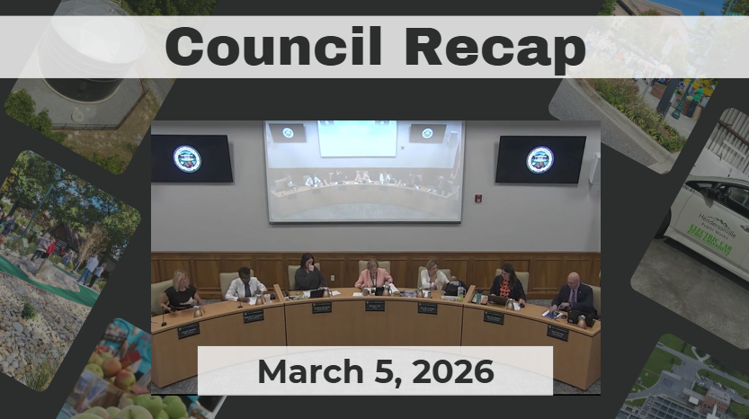 City Council members sit at dais. 