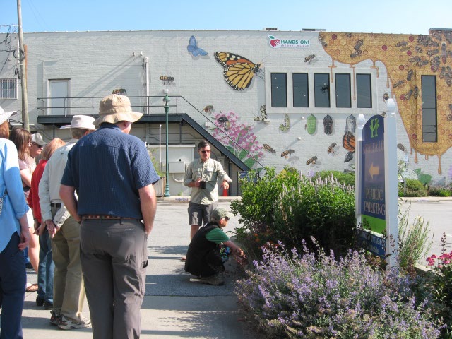 Bee Mural participants stand outside during reveal.